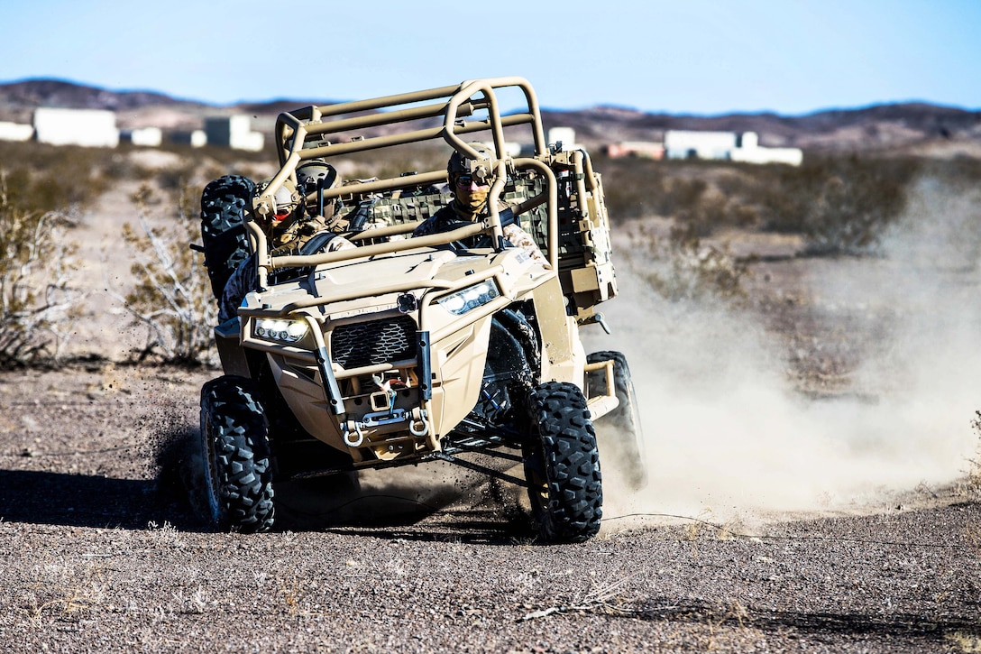 Marines maneuver in an all-terrain vehicle as a part of Integrated Training Exercise 2-18 at Marine Corps Air Ground Combat Center, Twentynine Palms, Calif.