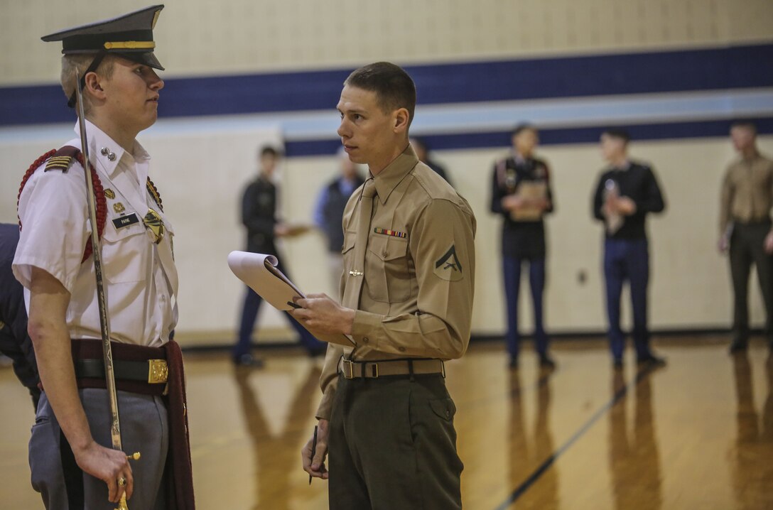 Members of the Silent Drill Platoon judged the 15th iteration of the Northern Virginia Region's JROTC drill competition, hosted at Liberty high school; Bealeton, Va. Marines supported the event as drill judges, which provided the junior reserve officers an opportunity to observe the mannerisms and standards of currently serving SDP Marines at Marine Barracks Washington. (Official Marine Corps photo by Cpl. Damon A. Mclean/Released)