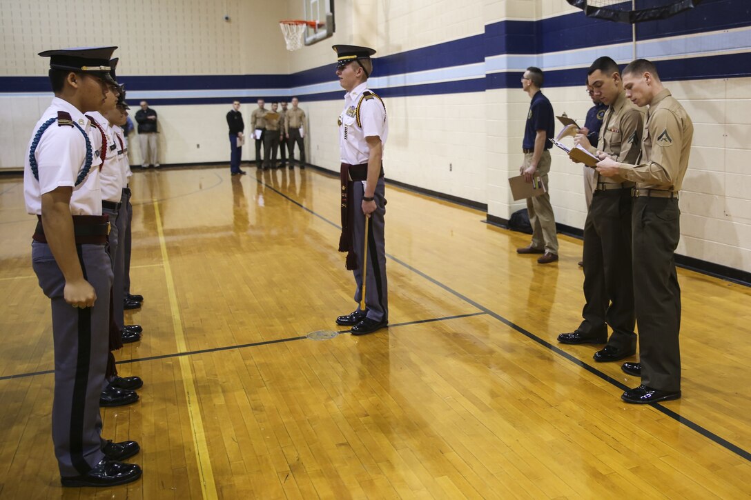 Members of the Silent Drill Platoon judged the 15th iteration of the Northern Virginia Region's JROTC drill competition, hosted at Liberty high school; Bealeton, Va. Marines supported the event as drill judges, which provided the junior reserve officers an opportunity to observe the mannerisms and standards of currently serving SDP Marines at Marine Barracks Washington. (Official Marine Corps photo by Cpl. Damon A. Mclean/Released)