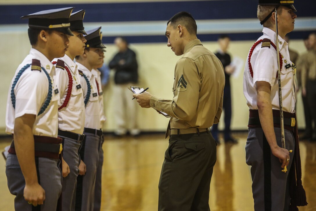 Members of the Silent Drill Platoon judged the 15th iteration of the Northern Virginia Region's JROTC drill competition, hosted at Liberty high school; Bealeton, Va. Marines supported the event as drill judges, which provided the junior reserve officers an opportunity to observe the mannerisms and standards of currently serving SDP Marines at Marine Barracks Washington. (Official Marine Corps photo by Cpl. Damon A. Mclean/Released)