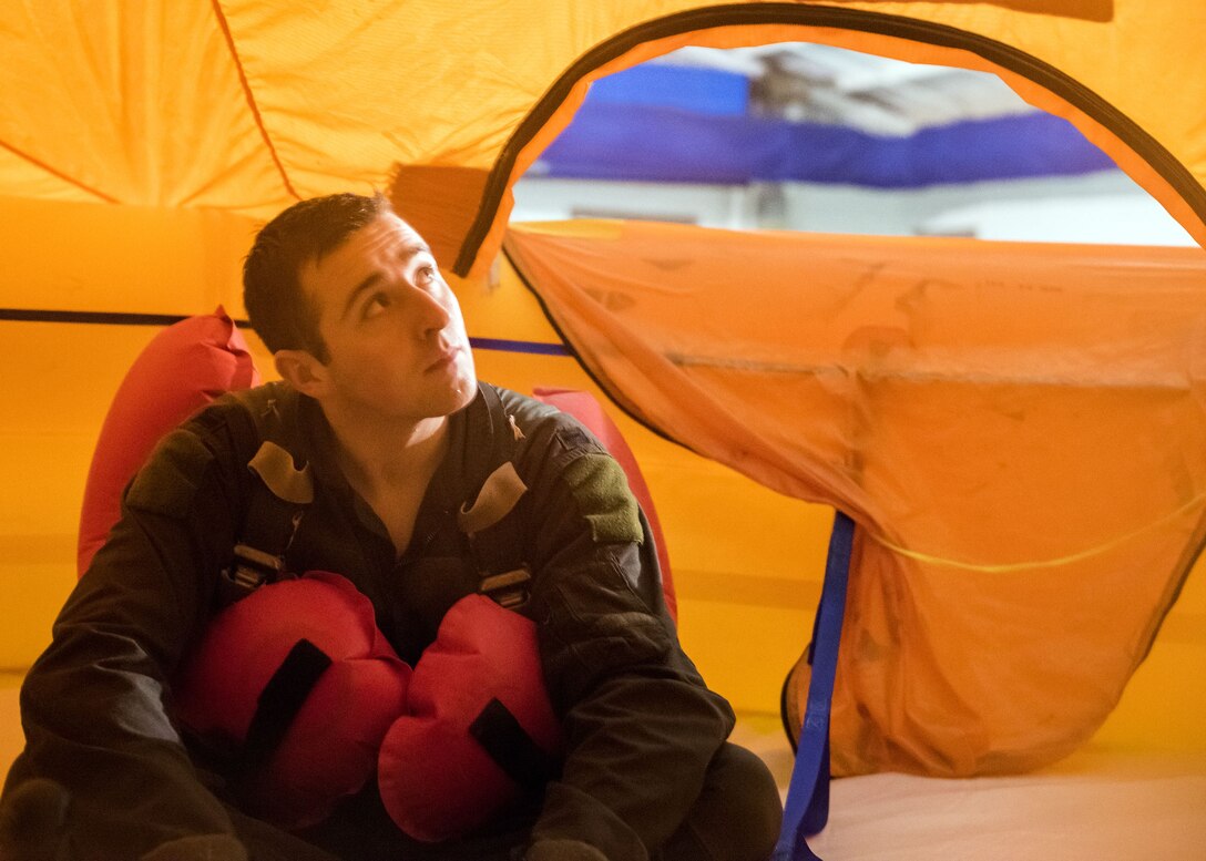 1st Lt. Kyle, 71st Rescue Squadron HC-130J Combat King II combat systems operator, looks out of a raft, Jan. 19, 2018, at Moody Air Force Base, Ga. Aircrew members participated in an underwater survival course to prepare themselves for a situation in which their aircraft were to crash in the water. (U.S. Air Force photo by Airman Eugene Oliver)