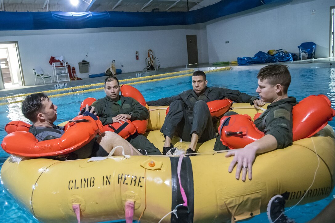 Aircrew members sit in a water raft, Jan. 25, 2018, at Moody Air Force Base, Ga. Aircrew members participated in an underwater survival course to prepare themselves for a situation in which their aircraft were to crash in the water. (U.S. Air Force photo by Airman Eugene Oliver)
