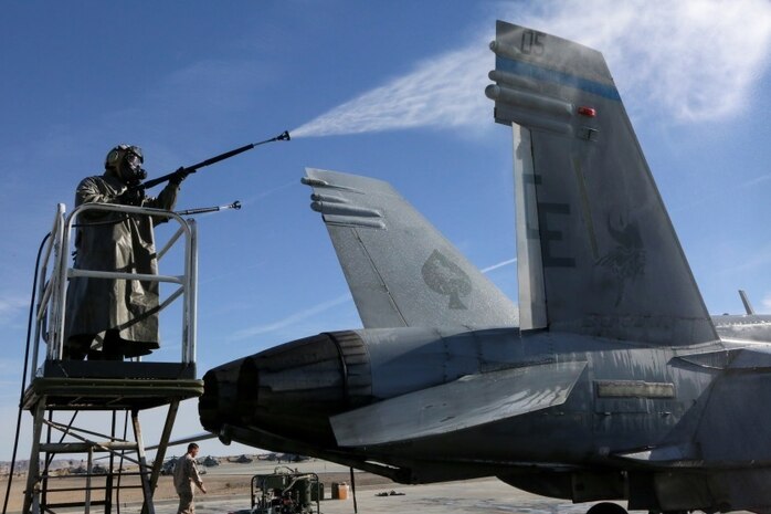 Marines with Marine Light Attack Helicopter Squadron (HMLA) 267 and Marine Aircraft Group (MAG) 39 chemical, biological, radiological and nuclear (CBRN) prepare for detailed aircraft decontamination training at Marine Corps Air Ground Combat Center, Twentynine Palms, Calif., Jan. 25. HMLA-267 Marines learned the five station, five-stage process and will now serve as subject matter experts on aircraft decontamination for their respective unit’s aircraft.