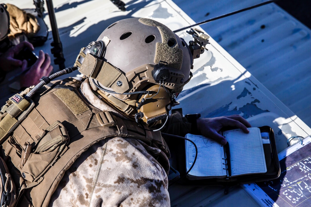 A Marine requests air support during Integrated Training Exercise 2-18 at Marine Corps Air Ground Combat Center, Twentynine Palms, Calif.
