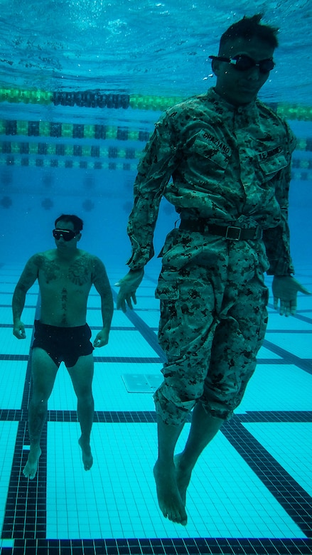A U.S. Marine Corps infantryman with Detachment 4th Force Reconnaissance Company conducts a pool training event, Marine Corps Base Hawaii, Jan. 22, 2018.