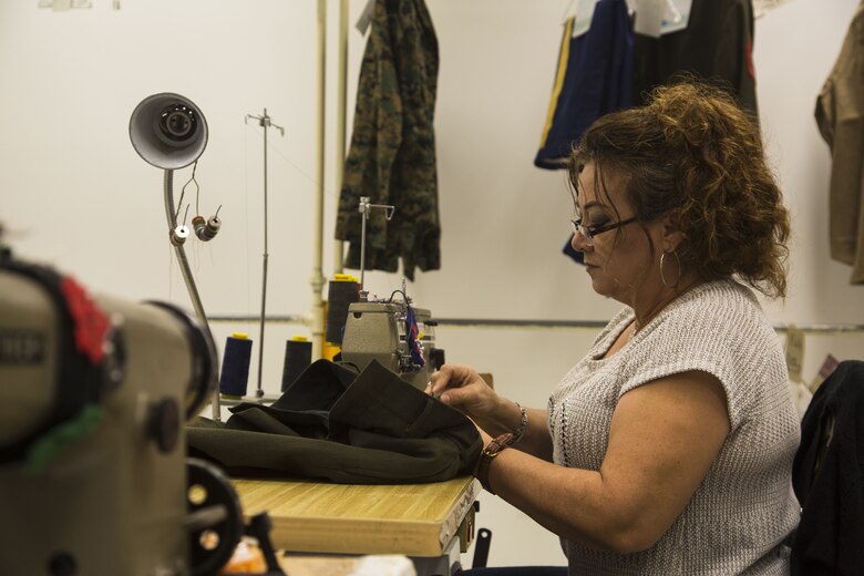 Blanca Quintero, a seamstress at the station dry-cleaners, alters a pair of U.S. Marine Corps service trousers at the dry-cleaners on Marine Corps Air Station Yuma, Ariz., Jan. 10, 2017. The station dry-cleaners is a service provided by the Marine Corps Exchange (MCX) to Marines and civilians, which provides them the opportunity to get their garments cleaned, pressed, fitted, altered or a combination of services if needed. (U.S. Marine Corps photo taken by Cpl. Isaac Martinez)