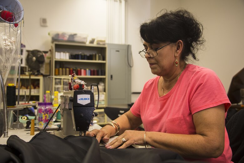 Isabel Andrade, a seamstress at the station dry-cleaners, alters a U.S. Marine Corps dress blue skirt at the dry-cleaners on Marine Corps Air Station Yuma, Ariz., Jan. 10, 2017. The station dry-cleaners is a service provided by the Marine Corps Exchange (MCX) to Marines and civilians, which provides them the opportunity to get their garments cleaned, pressed, fitted, altered or a combination of services if needed. (U.S. Marine Corps photo taken by Cpl. Isaac Martinez)
