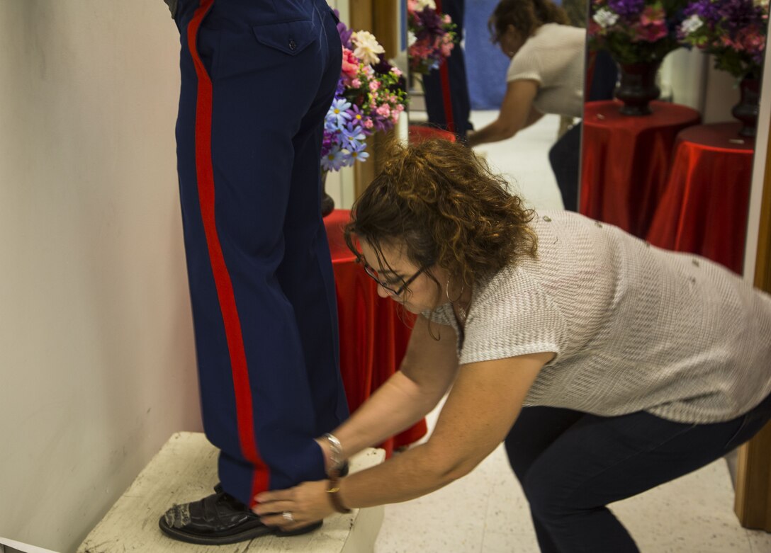 Blanca Quintero, a seamstress at the station dry-cleaners, measures a U.S. Marine’s dress blue trousers for alterations at the dry-cleaners on Marine Corps Air Station Yuma, Ariz., Jan. 10, 2017. The station dry-cleaners is a service provided by the Marine Corps Exchange (MCX) to Marines and civilians, which provides them the opportunity to get their garments cleaned, pressed, fitted, altered or a combination of services if needed. (U.S. Marine Corps photo taken by Cpl. Isaac Martinez)