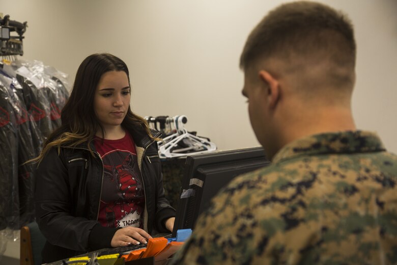 Jasmine Templin, the dry-cleaner’s supervisor, rings up a U.S. Marine’s order at the dry-cleaners on Marine Corps Air Station Yuma, Ariz., Jan. 10, 2017. The station dry-cleaners is a service provided by the Marine Corps Exchange (MCX) to Marines and civilians, which provides them the opportunity to get their garments cleaned, pressed, fitted, altered or a combination of services if needed.  (U.S. Marine Corps photo taken by Cpl. Isaac Martinez)