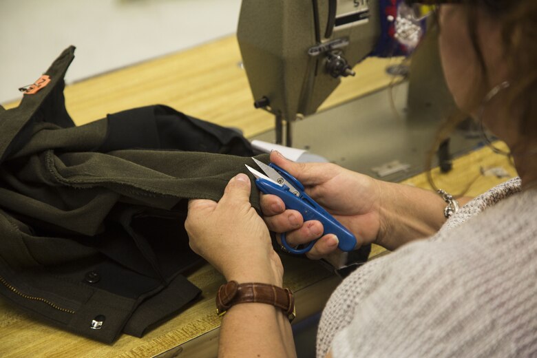 Blanca Quintero, a seamstress at the station dry-cleaners, alters a pair of U.S. Marine Corps service trousers at the dry-cleaners on Marine Corps Air Station Yuma, Ariz., Jan. 10, 2017. The station dry-cleaners is a service provided by the Marine Corps Exchange (MCX) to Marines and civilians, which provides them the opportunity to get their garments cleaned, pressed, fitted, altered or a combination of services if needed. (U.S. Marine Corps photo taken by Cpl. Isaac Martinez)