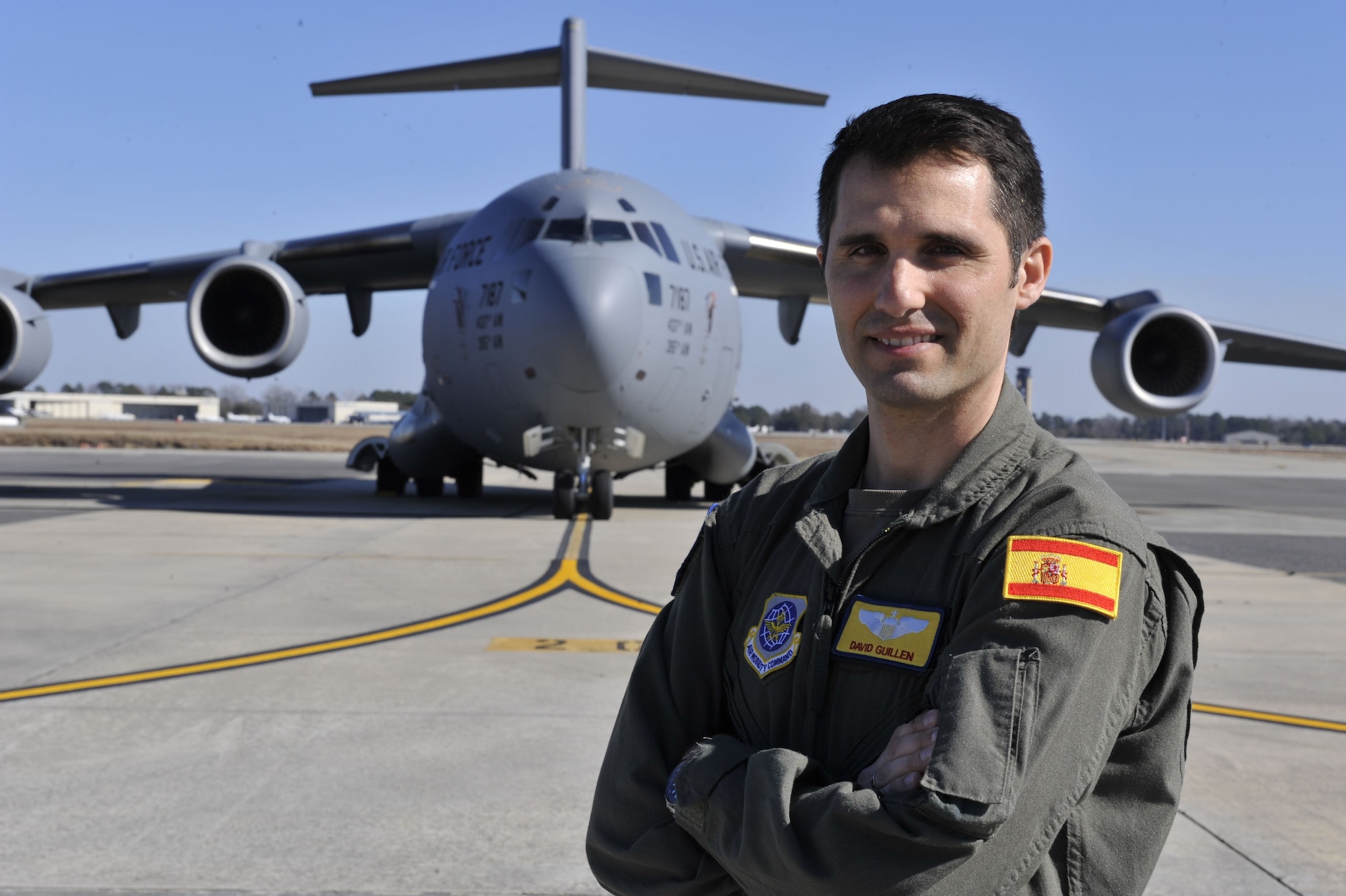 Capt. David Martinez Guillen, a Spanish Air Force pilot attached to the 16th Airlift Squadron at Joint Base Charleston, poses in front of a C-17 Globemaster III Jan. 25, 2018, at Joint Base Charleston, S.C.