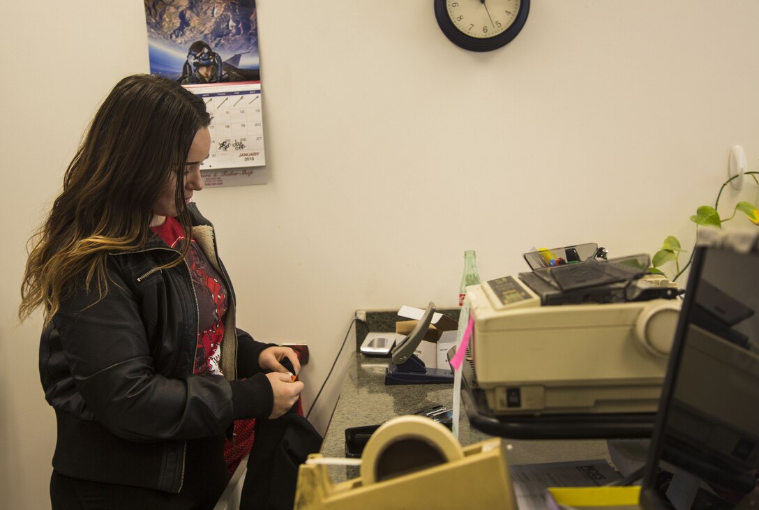 Jasmine Templin, the dry-cleaner’s supervisor, prepares a U.S. Marine Corps dress blue skirt for alterations at the dry-cleaners on Marine Corps Air Station Yuma, Ariz., Jan. 10, 2017. The station dry-cleaners is a service provided by the Marine Corps Exchange (MCX) to Marines and civilians, which provides them the opportunity to get their garments cleaned, pressed, fitted, altered or a combination of services if needed. (U.S. Marine Corps photo taken by Cpl. Isaac Martinez)