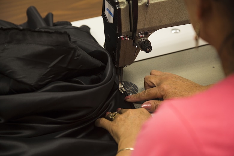 Isabel Andrade, a seamstress at the station dry-cleaners, alters a pair of U.S. Marine Corps service trousers at the dry-cleaners on Marine Corps Air Station Yuma, Ariz., Jan. 10, 2017. The station dry-cleaners is a service provided by the Marine Corps Exchange (MCX) to Marines and civilians, which provides them the opportunity to get their garments cleaned, pressed, fitted, altered or a combination of services if needed. (U.S. Marine Corps photo taken by Cpl. Isaac Martinez)