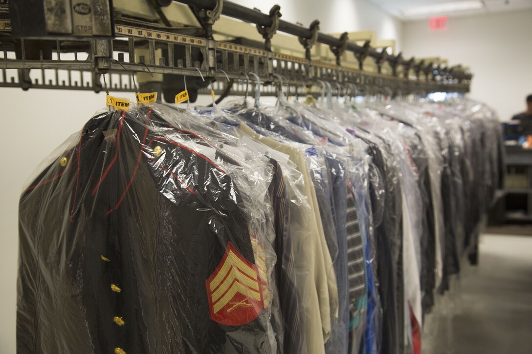 U.S. Marine Corps uniforms hang on turnstiles at the dry-cleaners on Marine Corps Air Station Yuma, Ariz., Jan. 10, 2017. The station dry-cleaners is a service provided by the Marine Corps Exchange (MCX) to Marines and civilians, which provides them the opportunity to get their garments cleaned, pressed, fitted, altered or a combination of services if needed. (U.S. Marine Corps photo taken by Cpl. Isaac Martinez)