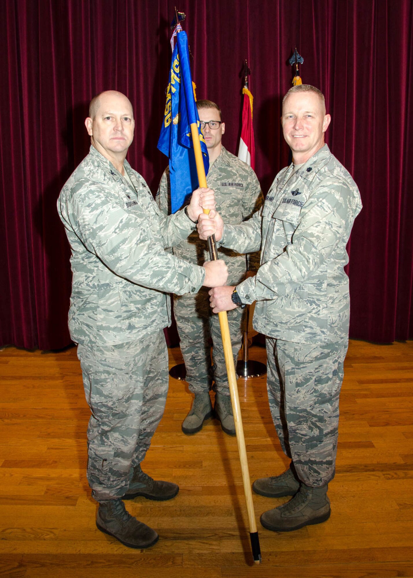 Lt. Col. Robert "South" Southerland takes command of the 131st Force Support Squadron from Col. Bill Boothman, acting 131st Mission Support Group commander, during a change of command ceremony at Whiteman Air Force Base, Missouri, Jan. 6, 2018.