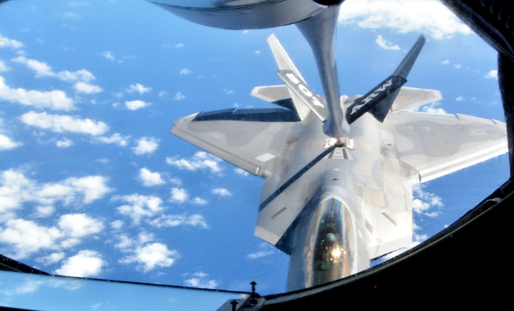 A 154th Wing Hawaii National Guard F-22 Raptor from Joint Base Pearl Harbor-Hickam, Hawaii, receives fuel from a 507th Air Refueling Wing KC-135R Stratotanker from Tinker Air Force Base, Okla., Jan. 22, 2018, in support of Exercise Sentry Aloha in Hawaii. (U.S. Air Force photo/Tech. Sgt. Samantha Mathison)