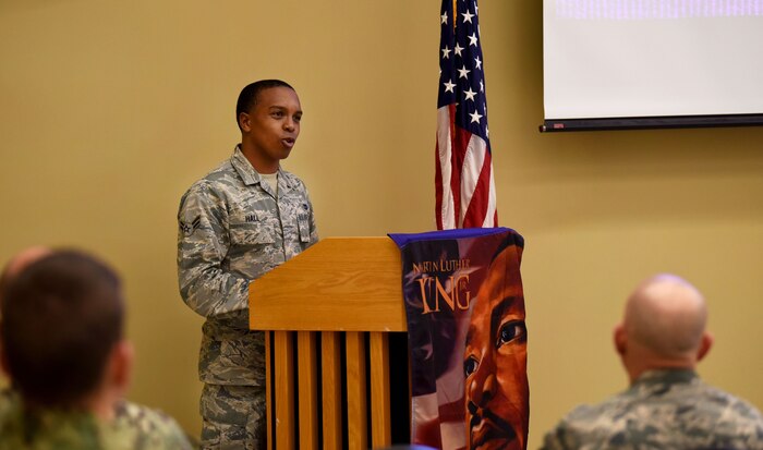 Airman 1st Class Joshua Hall, 437th Aerial Port Squadron cargo processing technician recites quotes from Martin Luther King Jr. during an observance event at the air base chapel, Joint Base Charleston, S.C., Jan. 29, 2018.