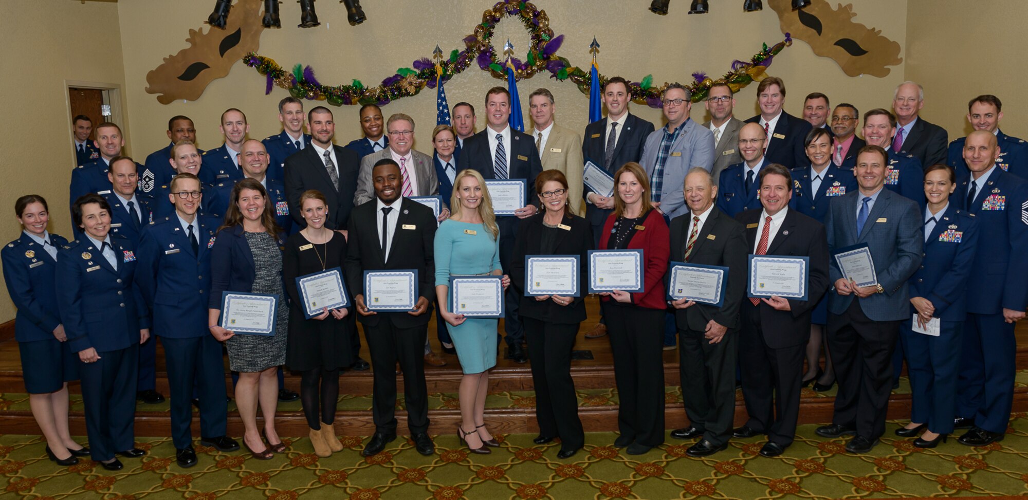 Keesler leadership pose for a group photo with the newly inducted honorary commanders during the 2018 Honorary Commanders Induction Ceremony at the Bay Breeze Event Center Jan. 26, 2018, on Keesler Air Force Base, Mississippi. The event recognized the newest members of Keesler’s honorary commanders program, which is a partnership between base leadership and local civic leaders to promote strong ties between military and civilian leaders. (U.S. Air Force photo by André Askew)
