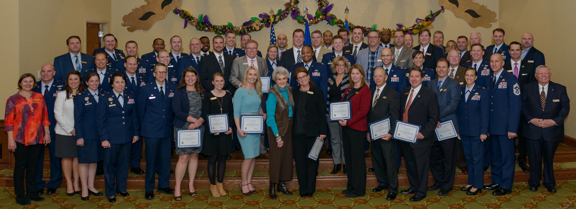Keesler leadership poses for a group photo with current and newly inducted honorary commanders during the 2018 Honorary Commanders Induction Ceremony at the Bay Breeze Event Center Jan. 26, 2018, on Keesler Air Force Base, Mississippi. The event recognized the newest members of Keesler’s honorary commanders program, which is a partnership between base leadership and local civic leaders to promote strong ties between military and civilian leaders. (U.S. Air Force photo by André Askew)