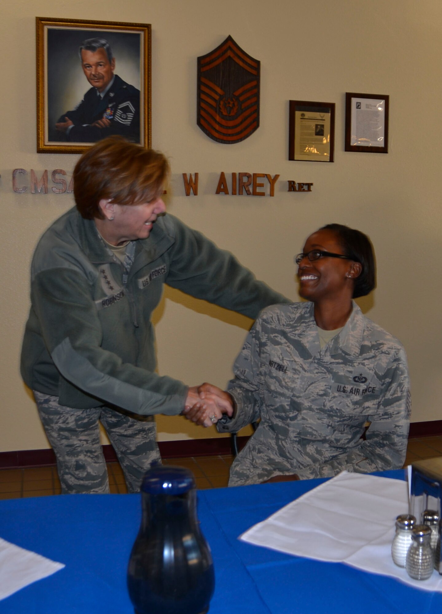 Gen. Lori Robinson, Commander, North American Aerospace Defense Command & Northern Command, greets Master Sgt. Megan Hartzell, 601st Air Operations Center, at a breakfast with Airmen at the Berg-Liles dining facility Jan. 18.  Pictured in the photo as a technical sergeant, Hartzell was recently promoted to her current rank. (Air Force Photo by Mary McHale)