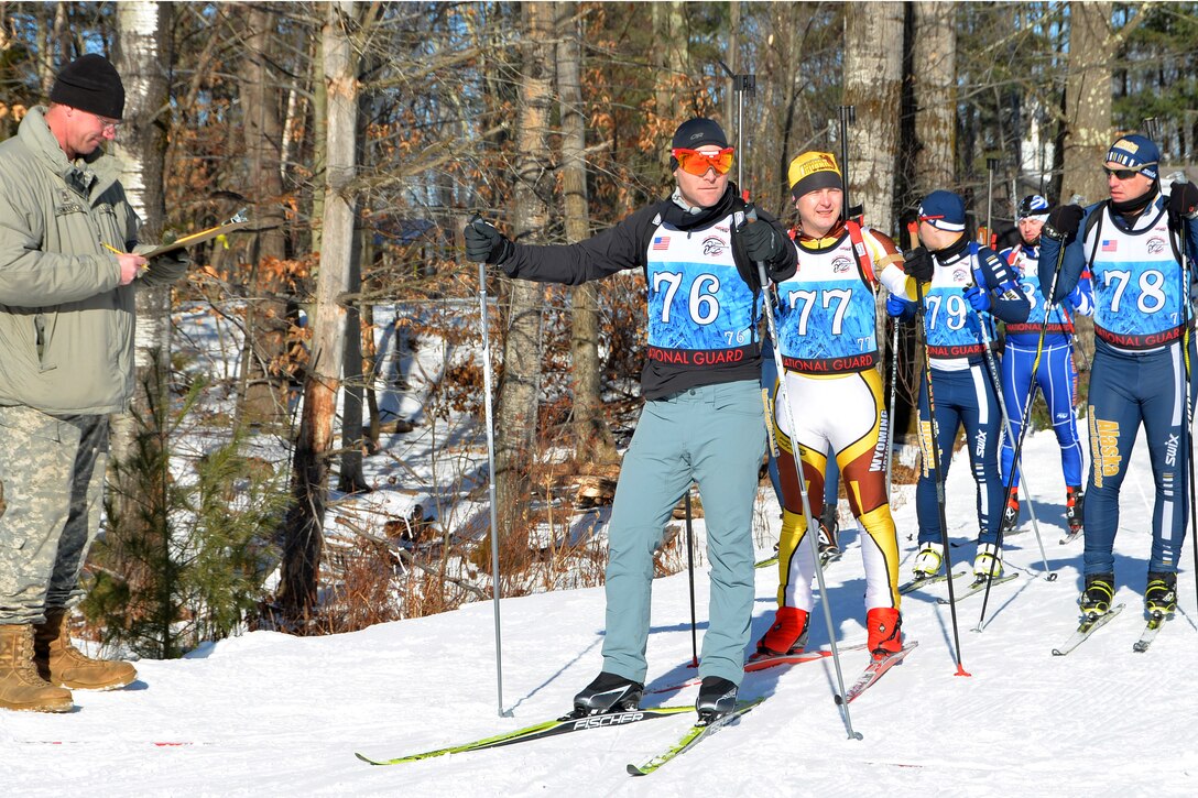 New York Army National Guard Capt. Joseph Moryl, center, prepares to compete.