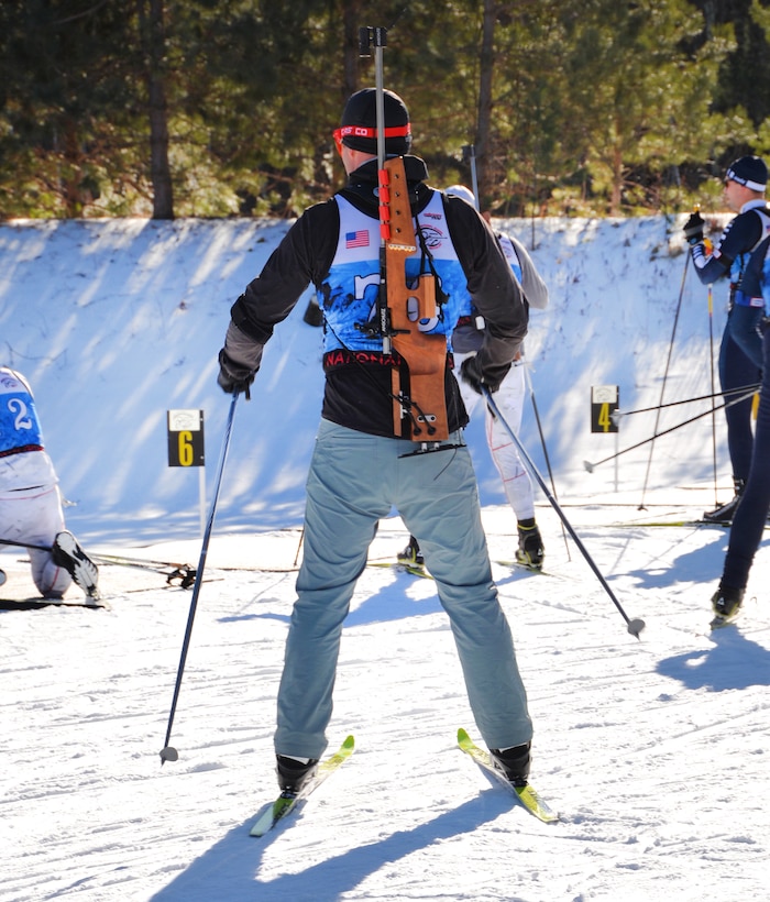 New York Army National Guard Capt. Joseph Moryl prepares to dismount his skis and fire his weapon at targets.