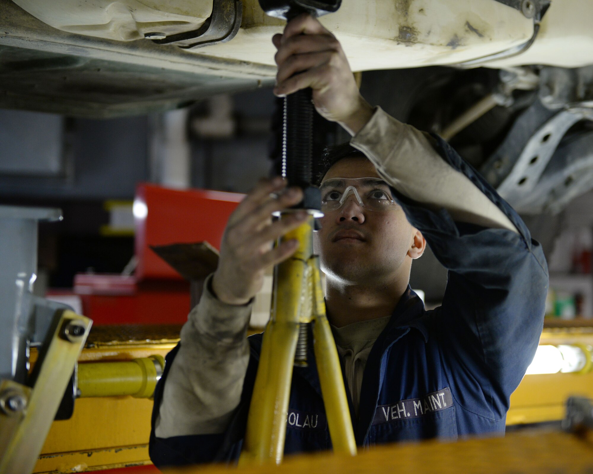 Senior Airman Teodorico Nicolau, mission general vehicle equipment maintenance journeyman with the 673d Logistics Readiness Squadron Vehicle Maintenance, General Purpose shop, uses a jack to support a transfer case for safety during an oil change, Jan. 25, 2018, at Joint Base Elmendorf-Richardson, Alaska. The General Purpose shop repairs and services multiple types of bobtails, busses, forklifts, Humvees and Wollard MB-4’s.