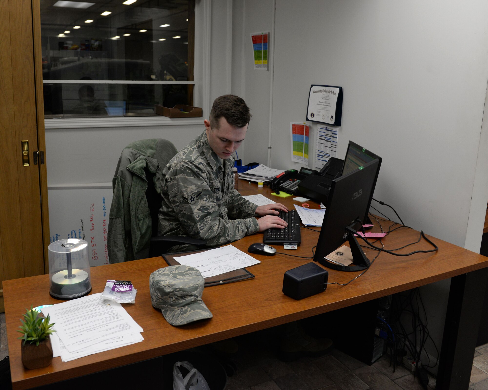 Airman Matthew Tracy, apprentice with the 673d Logistics Readiness Squadron Vehicle Maintenance, Fleet Management and Analysis shop, closes out a work order for a vehicle, Jan. 25, 2018, at Joint Base Elmendorf-Richardson, Alaska. FMNA maintains record jackets and maintenance schedules for all vehicle accounts in addition to opening and closing work orders for the vehicles customers bring in for maintenance.