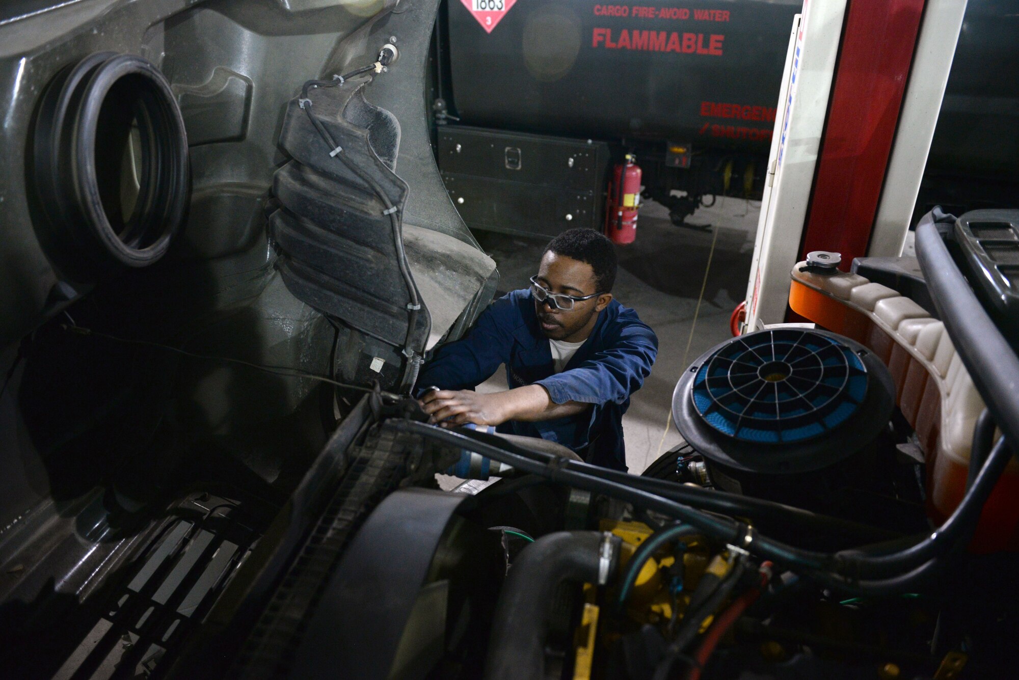 Airman 1st Class Warren Norwood, a mission general vehicle equipment maintenance apprentice with the 673d Logistics Readiness Squadron Vehicle Maintenance, Refueling Maintenance shop, changes the oil filter on an R-12, Jan. 26, 2018, at Joint Base Elmendorf-Richardson, Alaska. The Refueling Maintenance shop repairs and services all refueling equipment such as the R-11 and R-12 at JBER.
