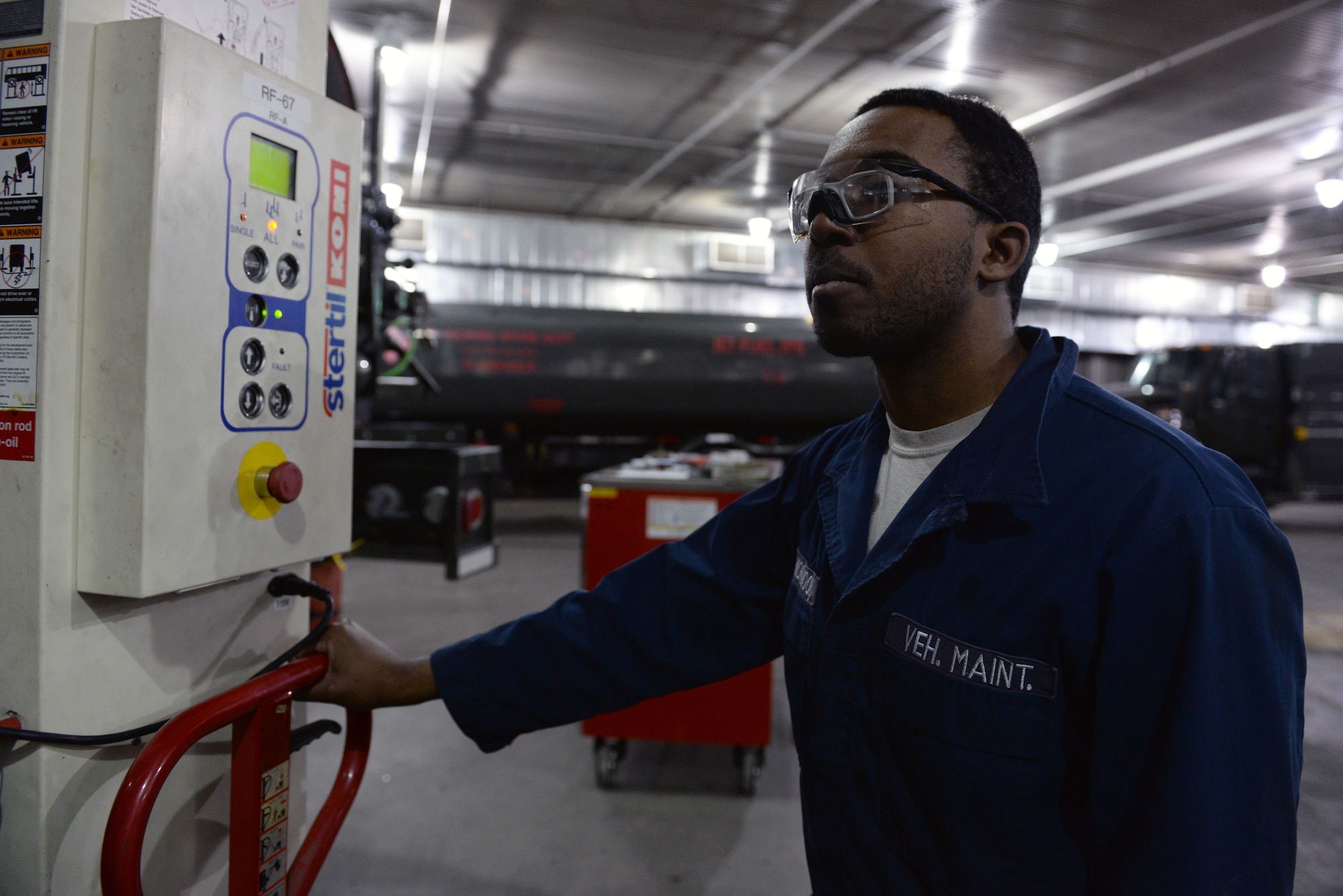 Airman 1st Class Warren Norwood, a mission general vehicle equipment maintenance apprentice with the 673d Logistics Readiness Squadron Vehicle Maintenance, Refueling Maintenance shop, operates a heavy truck lift, Jan. 26, 2018, at Joint Base Elmendorf-Richardson, Alaska. The Refueling Maintenance shop repairs and services all refueling equipment such as the R-11 and R-12 at JBER.