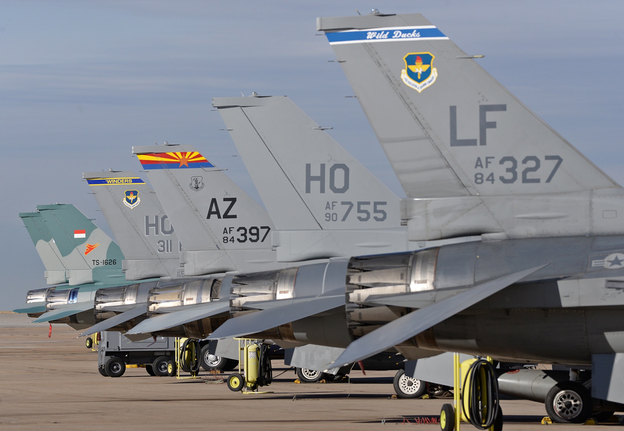 Six F-16 Fighting Falcons sit on the 514th Flight Test Squadron ramp at Hill Air Force Base, Utah, on Nov. 15, 2017. The aircraft are awaiting test flight or to be returned to their assigned units after completion of depot maintenance. (U.S. Air Force photo by Alex R. Lloyd)