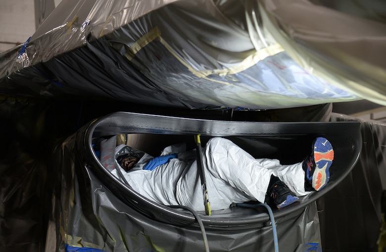 Mike Hughes, 573rd Aircraft Maintenance Squadron, sands down the inside of an air intake on a Colorado National Guard F-16 on Jan. 9, 2018, at Hill Air Force Base, Utah. (U.S. Air Force photo by Alex R. Lloyd)