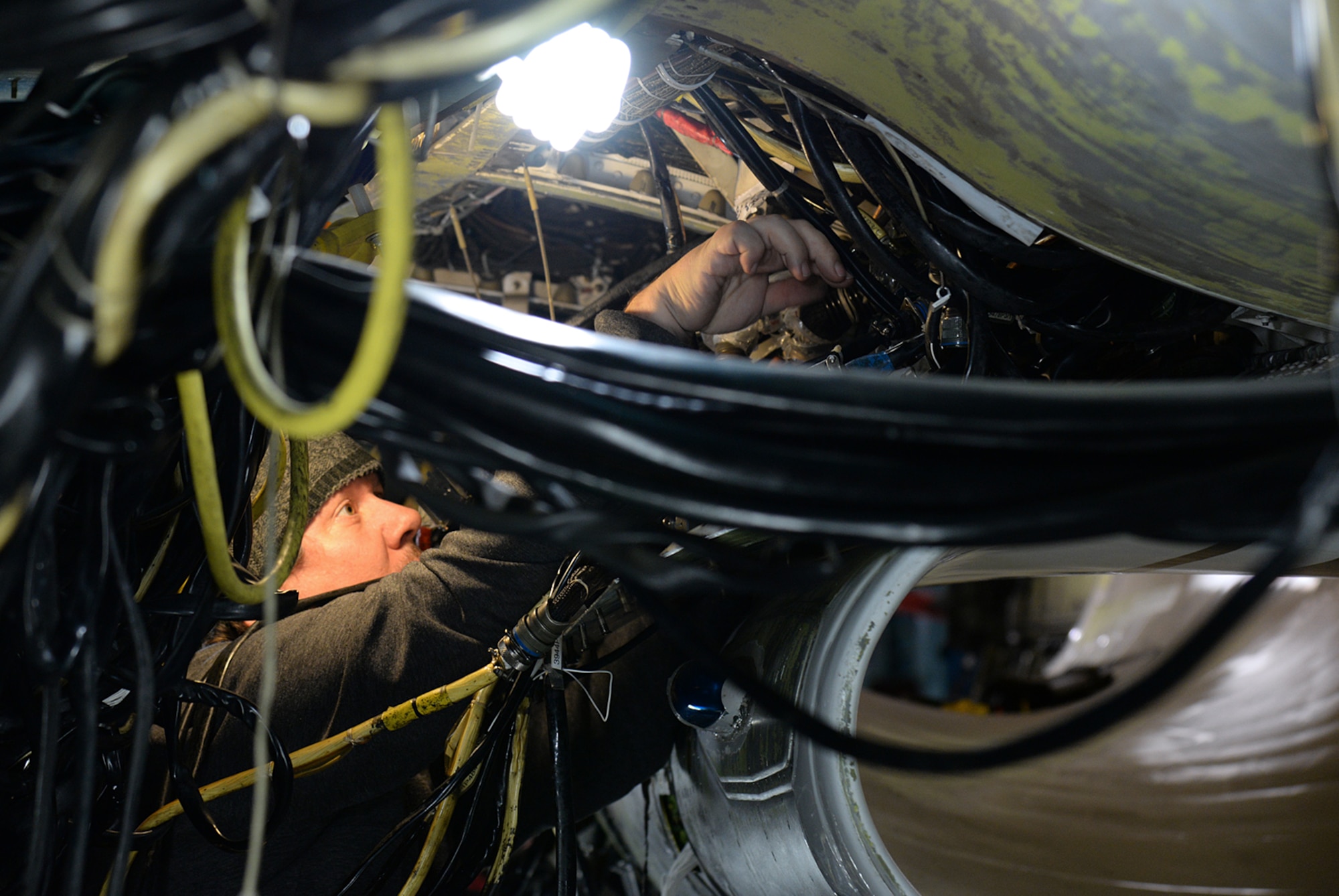 Bret Hadley, 573rd Aircraft Maintenance Squadron, performs an electronic check out on an F-16 undergoing service life extension program modification on Dec. 20, 2017, at Hill Air Force Base, Utah. The SLEP is a series of inspections and modifications taking place at one time to extend the aircraft flying service life to 2046. (U.S. Air Force photo by Alex R. Lloyd)