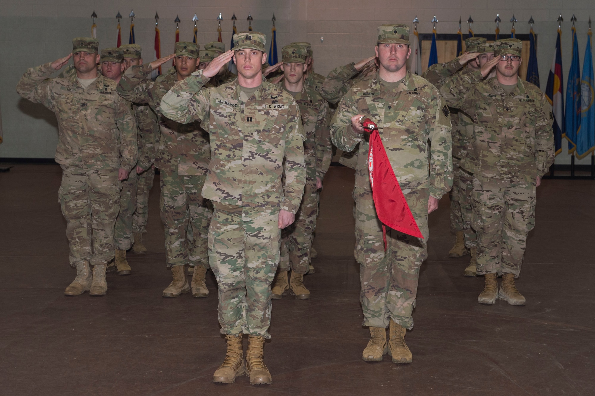 Members of the 74th Dive Detachment, 92nd Engineer Battalion, 20th Engineer Brigade salutes during a deployment ceremony at Joint Base Langley-Eustis, Va., Jan. 24, 2018. The 74th Dive Det. is planned to support Operation Spartan Shield by conducting dive operations to secure and maintain land-ready operational forces and hinder aggression in the region. (U.S. Air Force photo by Senior Airman Derek Seifert)