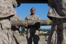 Recruits with Kilo Company, 3rd Recruit Training Battalion, perform log drills at Marine Corps Recruit Depot San Diego, Jan. 22. The recruits had to hold the log as a team for the entire session, which lasted for approximately an hour. Annually, more than 17,000 males recruited from the Western Recruiting Region are trained at MCRD San Diego. Kilo Company is scheduled to graduate March 16.
(Photo by: Lance Cpl. Alexander L. Gist)