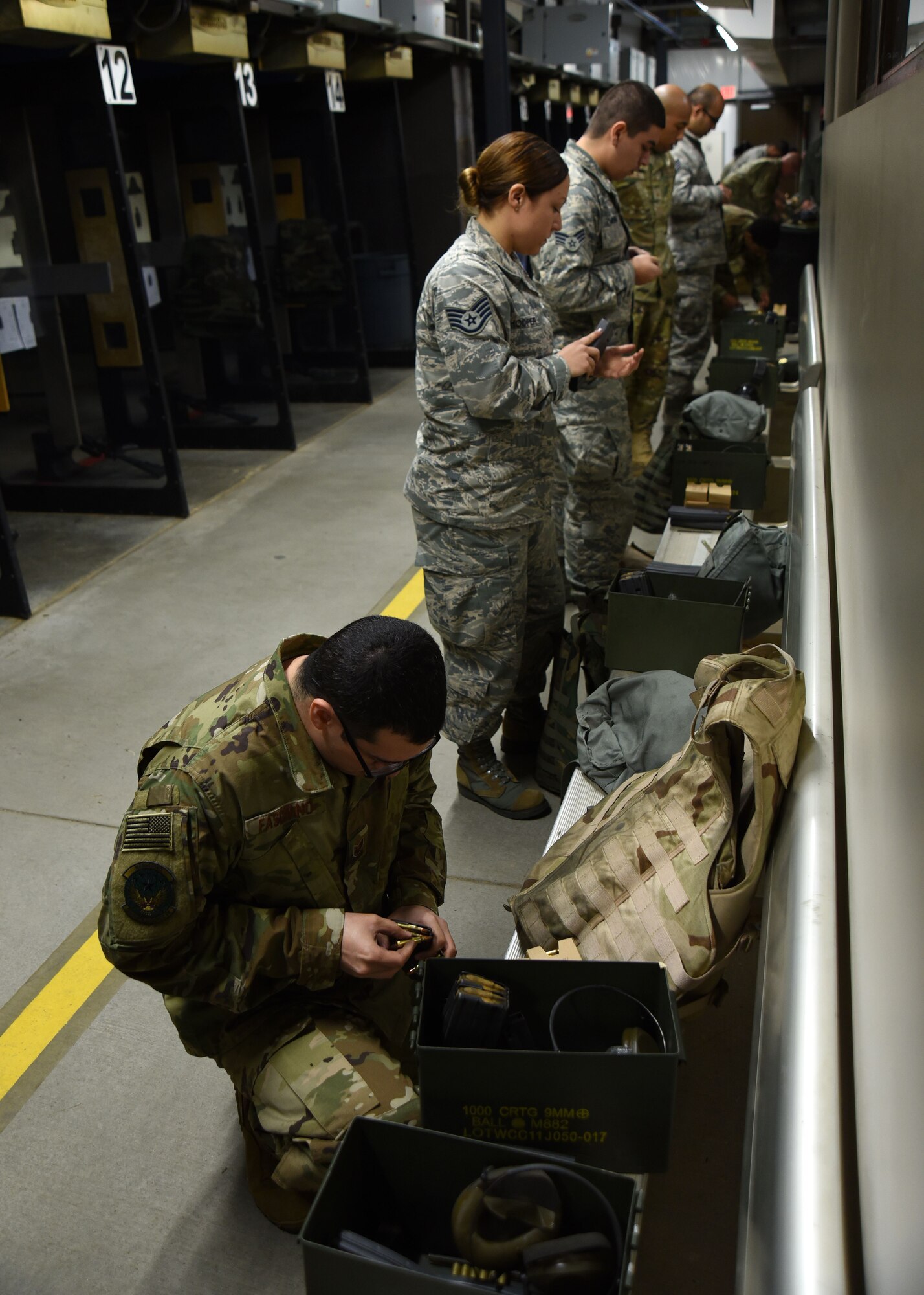 U.S. Airmen load magazines with ammunition during an M4 carbine qualification course at Shaw Air Force Base, S.C., Jan. 25, 2018.