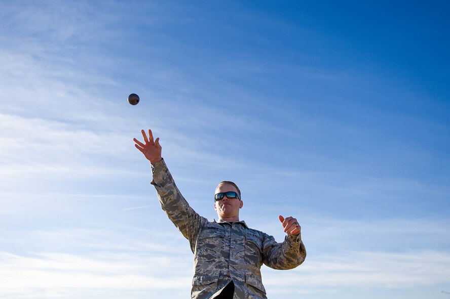 Senior Airman Devon Tanner, 56th Communications Squadron network infrastructure technician, throws a simulated grenade during a combat fitness test challenge at Luke Air Force Base, Ariz., Jan. 26, 2018. During the CFT, a Marine Corps physical fitness requirement, a simulated grenade was thrown into a pre-determined area in addition to other combat related tasks. The competition was held between Marines and Airmen to build esprit de corps among the two services. (U.S. Air Force photo/Staff Sgt. Jensen Stidham)