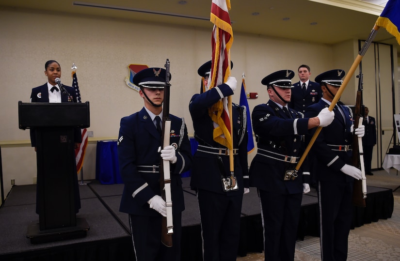 The Joint Base Charleston Honor Guard present the colors during the national anthem sung by Tech. Sgt. Kaneisha Lipscomb, Joint Base Charleston Airman Leadership School instructor, at the Charleston Club, JB Charleston, S.C., Jan 26. 2017. The ceremony was held to recognize and award the best and brightest members from the 628th ABW.