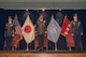 Royal Australian Air Force Group Captain Adam Williams, incoming United Nations Command (Rear) commander, U.S. Army General Vincent K. Brooks, United Nations Command, Combined Forces Command and U.S. Forces Korea commanding general stand in attention during a change of command ceremony