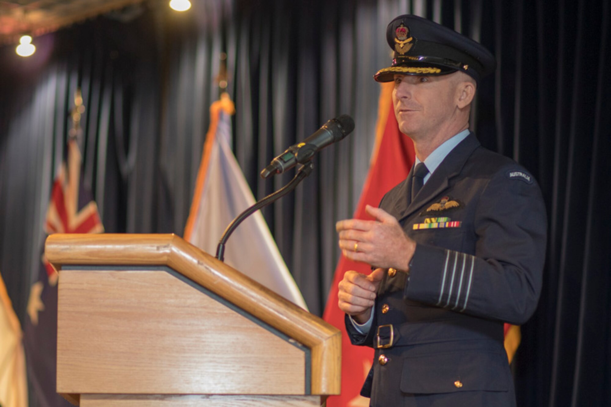 Royal Australian Air Force Group Captain Adam Williams, United Nations Command (Rear) commander, gives a speech during the UNC (Rear) change of command ceremony