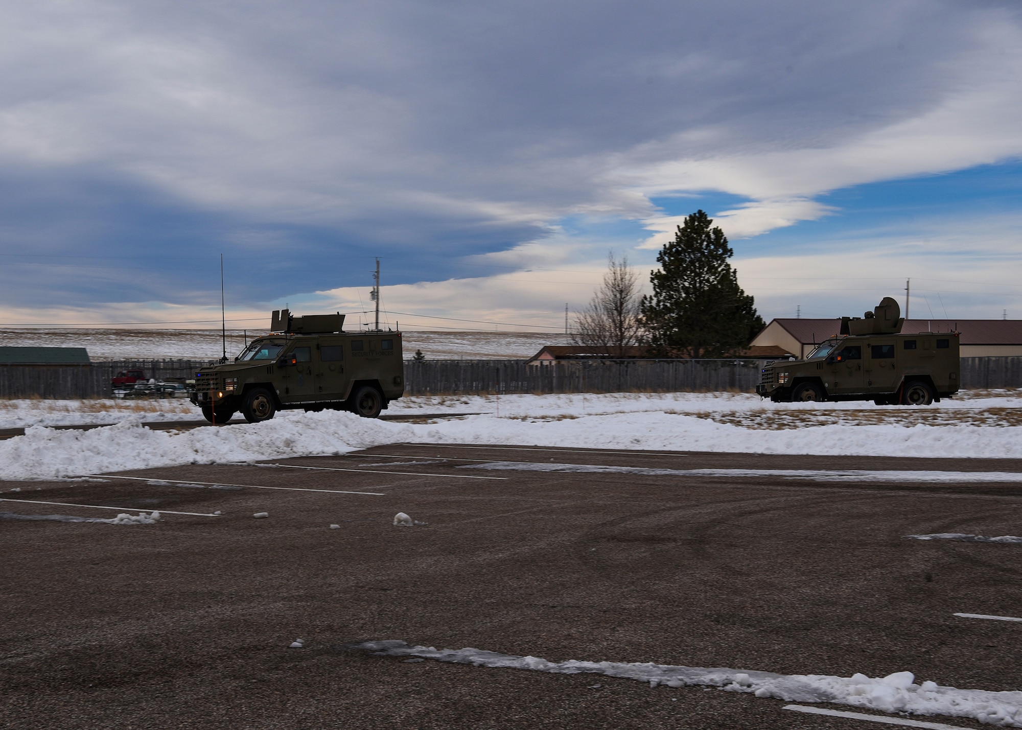 A convoy rolls out of F.E. Warren Air Force Base, Wyo., with non-security forces members for the first time Jan. 25, 2018. A Marine and an Air Force missileer rode inside a Humvee within the convoy, allowing them to cross-talk with other career fields. (U.S. Air Force photo by Airman 1st Class Abbigayle Wagner)