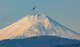 A C-130J Super Hercules assigned to the 36th Airlift Squadron fries nearby Mt. Fuji, Japan, during a routine sortie,