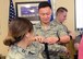 Capt. Christopher Liu, 412th Medical Operations Squadron, applies a tourniquet to Capt. Regina Ortega, 412th MDOS, at the 412th Medical Group’s Education and Training building Jan. 29. (U.S. Air Force photo by Kenji Thuloweit)