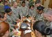 Capt. Christopher Liu, 412th Medical Operations Squadron, applies a tourniquet to Capt. Regina Ortega, 412th MDOS, at the 412th Medical Group’s Education and Training building Jan. 29. (U.S. Air Force photo by Kenji Thuloweit)