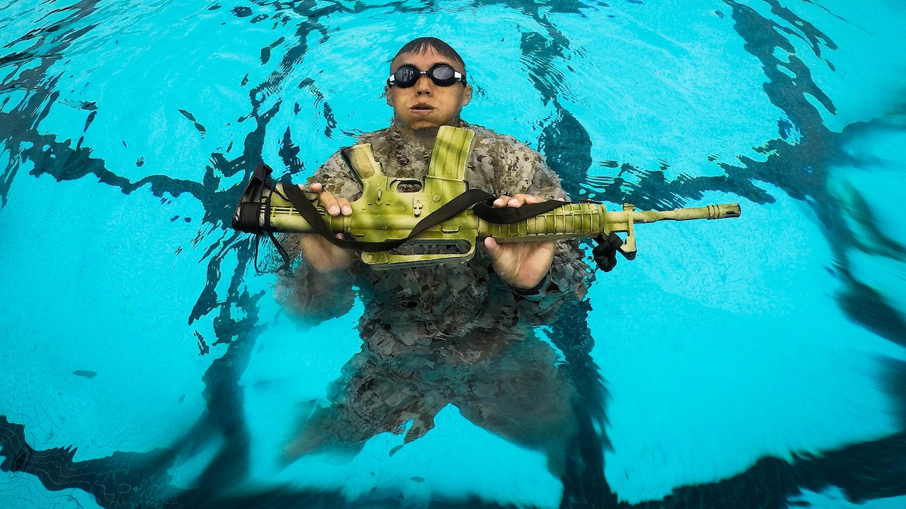 A U.S. Marine Corps infantryman with Detachment 4th Force Reconnaissance Company conducts a pool training event, Marine Corps Base Hawaii, Jan. 22, 2018.