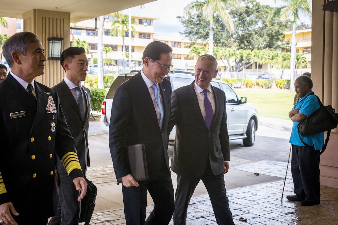 U.S. and South Korean defense leaders walk together before a meeting in Hawa