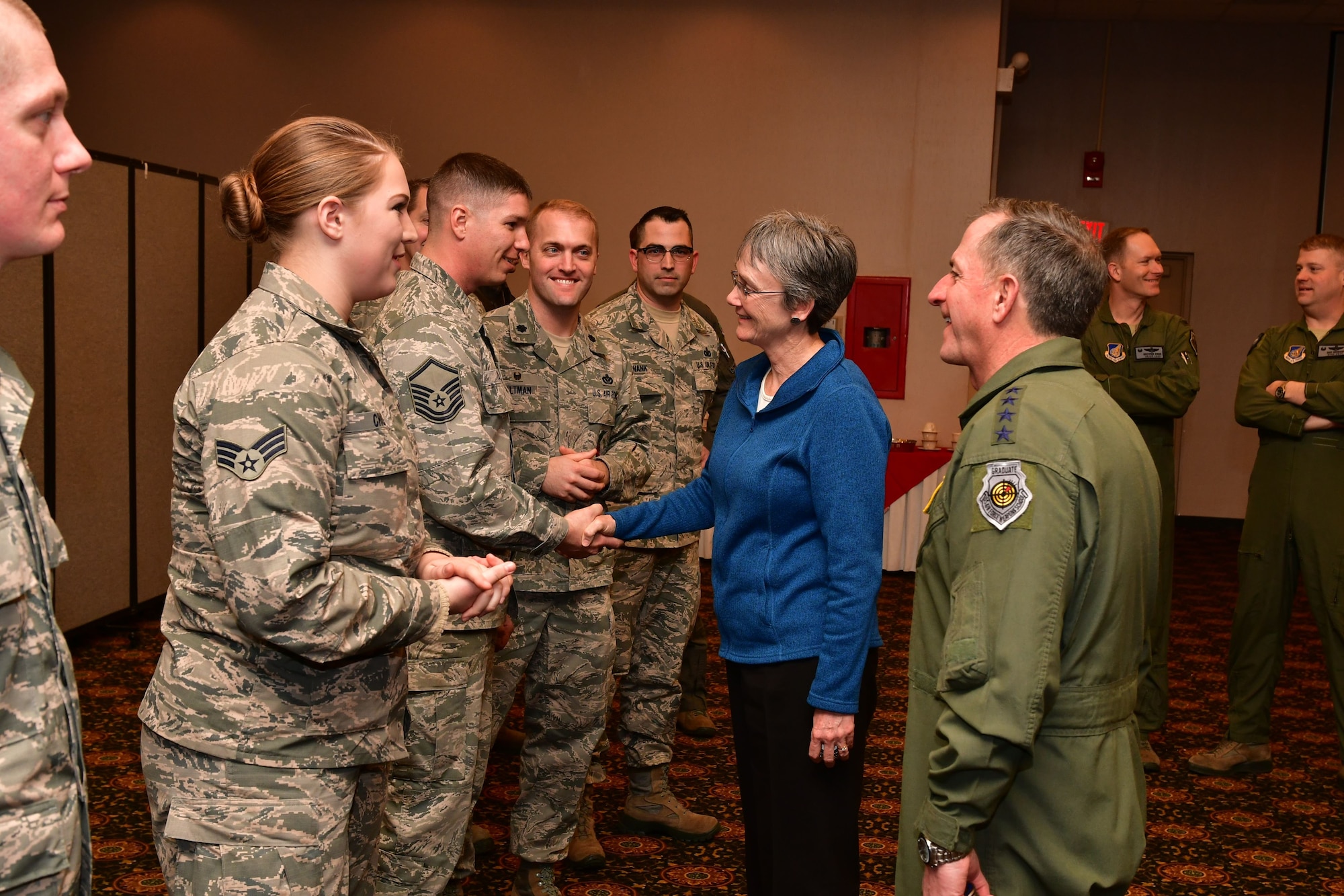 Secretary of the Air Force Heather Wilson and Air Force Chief of Staff Gen. David L. Goldfein shake hands with Airmen from the 8th Fighter Wing at Osan Air Base, Republic of Korea, January 29, 2018. Members of the Wolf Pack were recognized as superior performers by Wilson and Goldfein and briefed the senior leaders on the specific mission sets in their respective fields. (U.S. Air Force photo by Staff Sgt. Franklin R. Ramos)