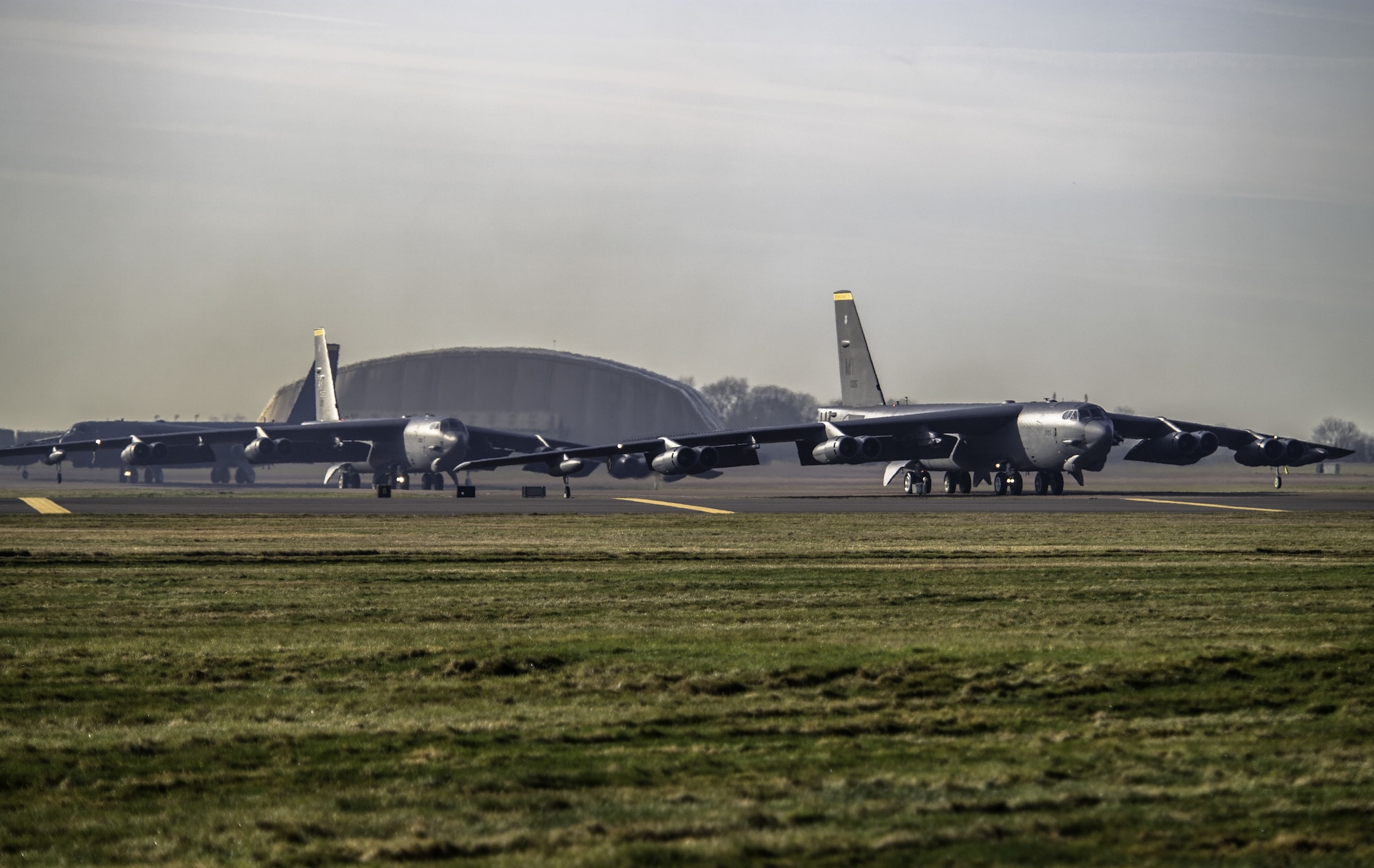 Three B-52 Stratofortress aircraft prepare to take off from RAF Fairford, England, en route to their home station at Minot Air Force Base, N.D., on Jan 30, 2018. Approximately 300 Airmen assigned to the 5th Bomb Wing deployed to the United Kingdom to conduct theater integration and flying training. (U.S. Air Force photo by Staff Sgt. Trevor T. McBride)