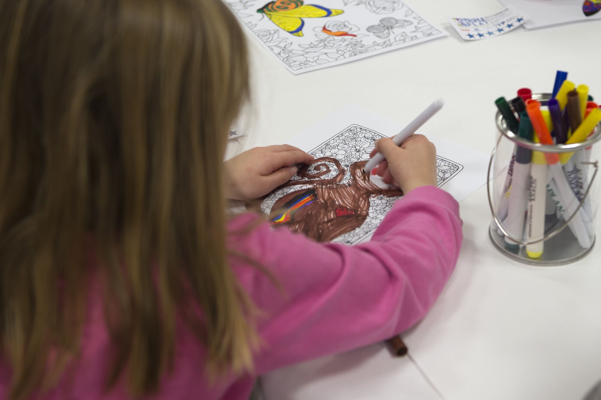A child draws a picture at the Youth Center at RAF Alconbury, United Kingdom, Jan. 26, 2018. The drawing was part of a Get Fit Challenge which focused on all aspects of health. (U.S. Air Force photo by Senior Airman Chase Sousa)