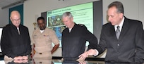 IMAGE: DAHLGREN, Va. (Jan. 16, 2018) – Naval Surface Warfare Center Dahlgren Division (NSWCDD) Innovation Lab (iLab) Director of Innovation Nelson Mills briefs the Commander of Naval Sea Systems Command (NAVSEA) Vice Adm. Thomas Moore, NAVSEA Command Master Chief Robert Crossno, and NSWCDD Commanding Officer Capt. Gus Weekes, on the use of digital collaboration tables as visual aids for surface ships. The collaboration table could provide capabilities to view ship doctrine, navigation tracks, radar information, and Automatic Identification System information for situational awareness. The iLab – equipped with state-of-the-art equipment, services, and trained personnel – opened for business last summer as an intensive collaborative environment where the command's experts work to speed up and maximize corporate innovative solutions across the laboratory. 

The iLab was one stop in the admiral's tour of Dahlgren, which gave him an opportunity to meet with the command's leaders, scientists, and engineers. It was the first in a series of scheduled visits to the NAVSEA Warfare Center divisions under the theme of “Warfare Centers – The Campaign Plan in Action.” While at the iLab, Weekes briefed the NAVSEA commander on Dahlgren technical programs, including directed energy, electromagnetic railgun, chemical, biological, and radiological defense, as well as leadership development. Moore's Campaign Plan is focused on three mission priorities: on-time delivery of ships and submarines, culture of affordability, and cybersecurity. These priorities address today's challenges and provide the focus to achieve NAVSEA's mission and support the Fleet.